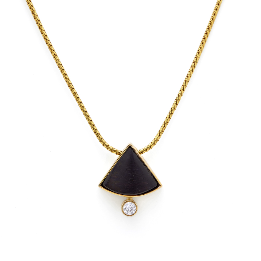 Anhänger in 750/°°° Gold mit Brillant und Ebenholz